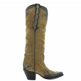 Suede dijon tall boot with leather overlayed and studs. Angled to the right