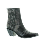 Black botin with geometric design lasered on the side. Botin angled