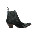 Black botin wih suede overlayed leather. Botin angled to the right